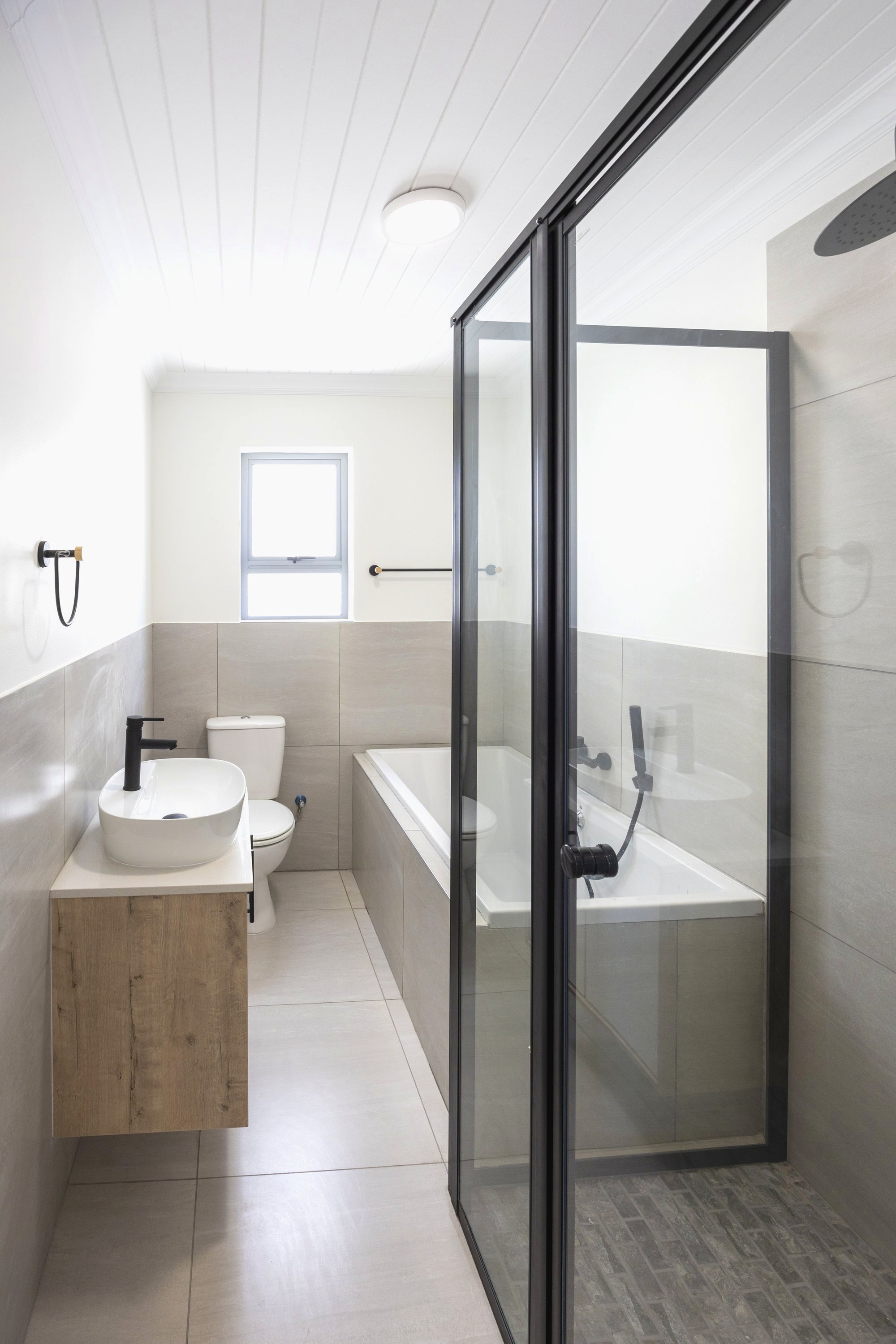 Bathroom with freestanding basin and bath
